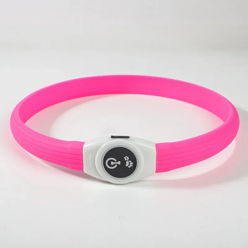 Waterproof LED Luminous USB Dog Collar in vibrant pink with power button for visibility during nighttime walks.