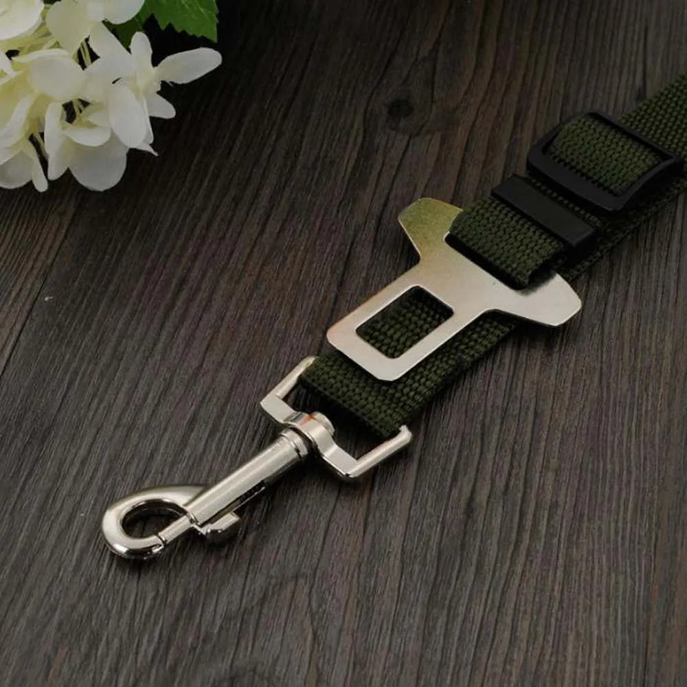 Dog Car Safety Belt for Small & Medium Pets buckle and clip detail on a wooden surface.